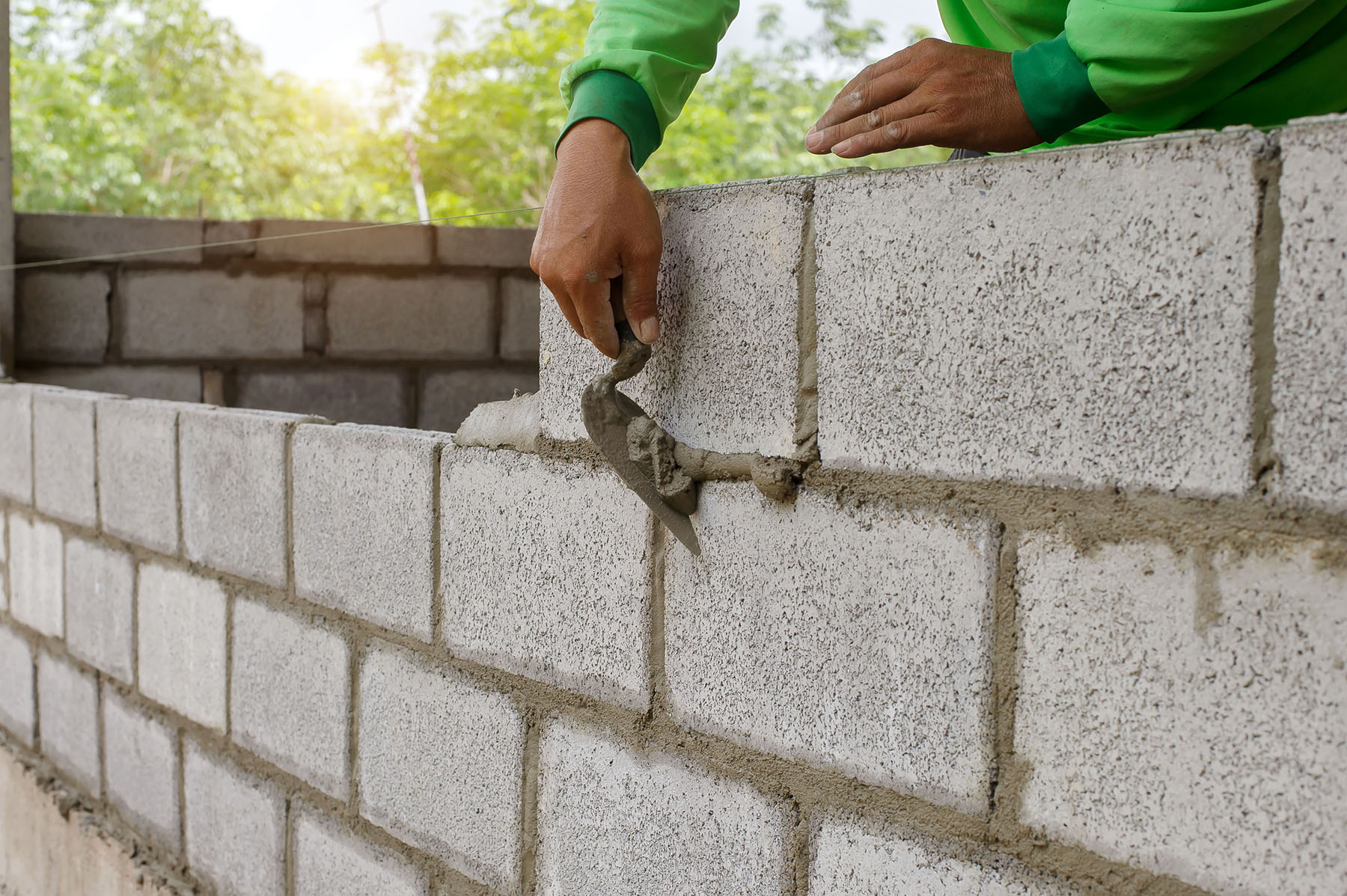 masonry worker laying concrete wall in Scottsdale, AZ